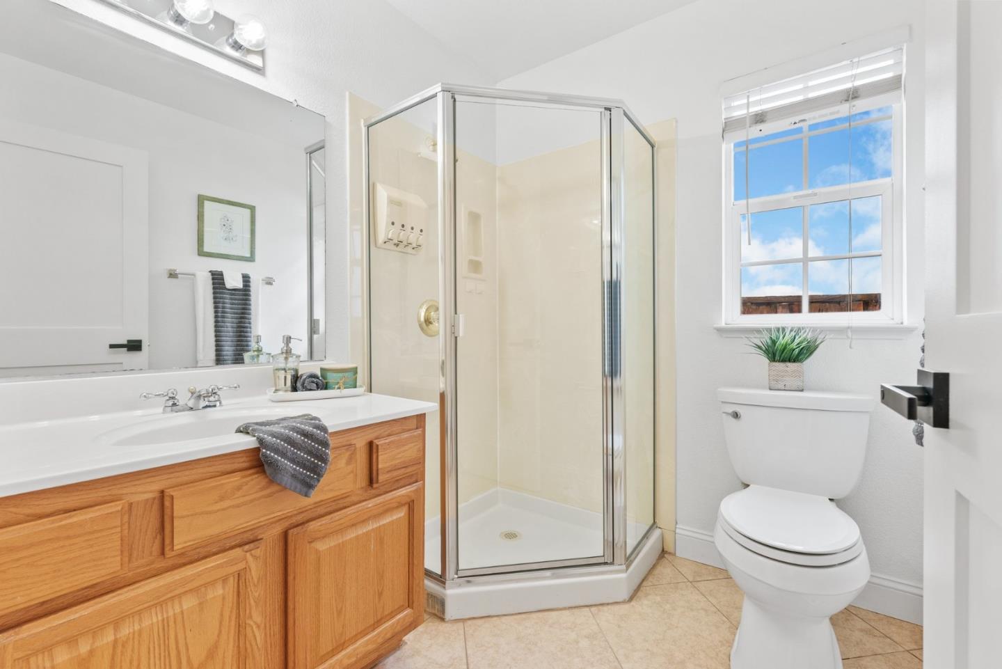 75 Paloma Drive Morgan Hill, CA 95037 - Photo 36 of 53 a spacious bathroom with a granite countertop sink a toilet a mirror and shower
