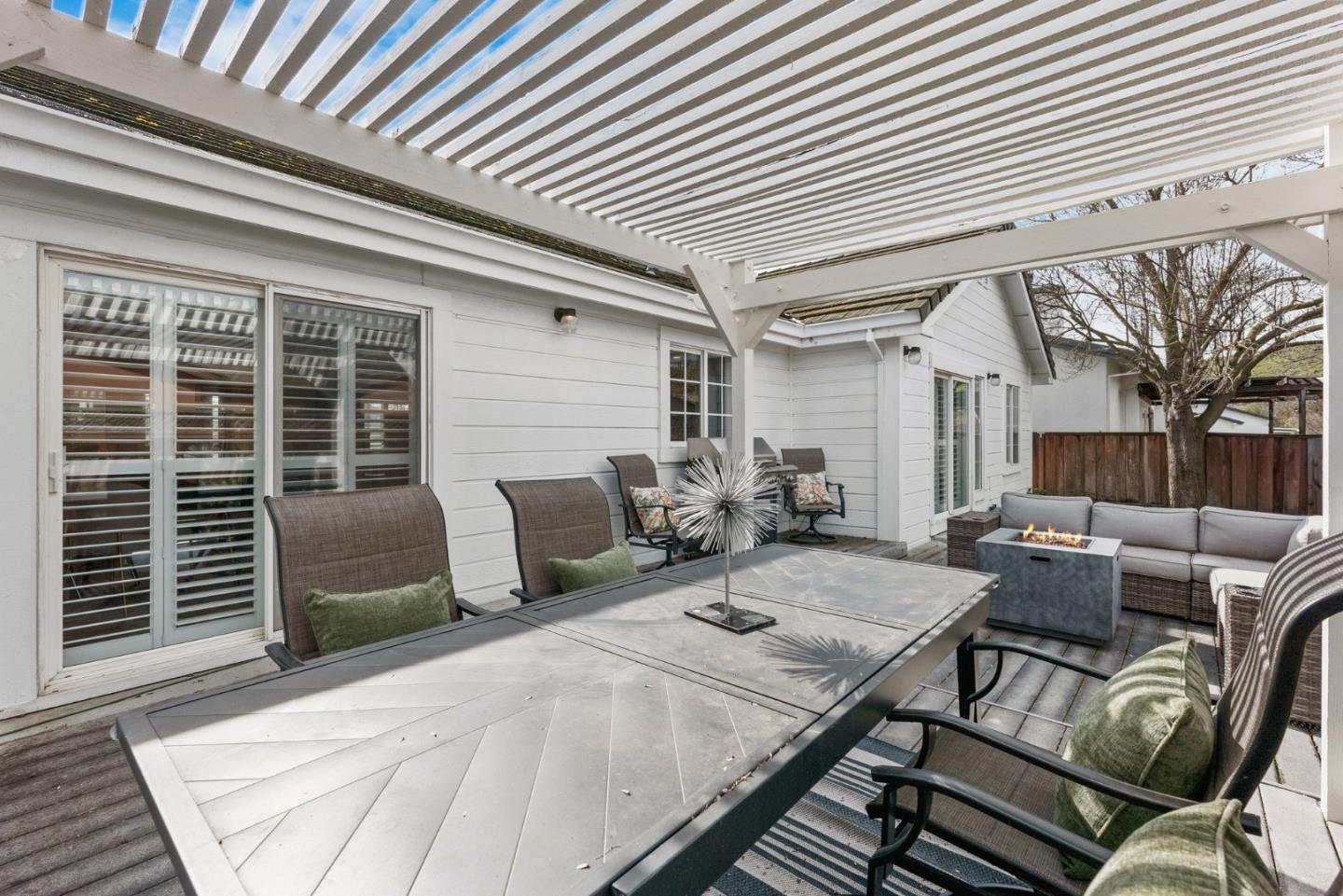 75 Paloma Drive Morgan Hill, CA 95037 - Photo 39 of 53 a view of a patio with a table and chairs and wooden floor