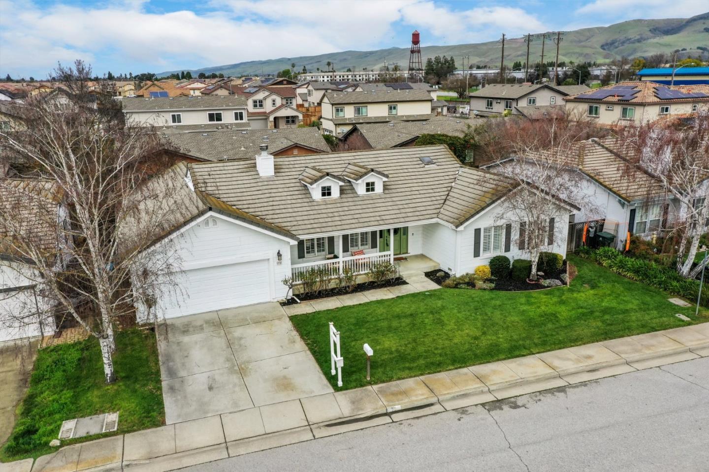 75 Paloma Drive Morgan Hill, CA 95037 - Photo 48 of 53 a view of a white house next to a yard with big trees