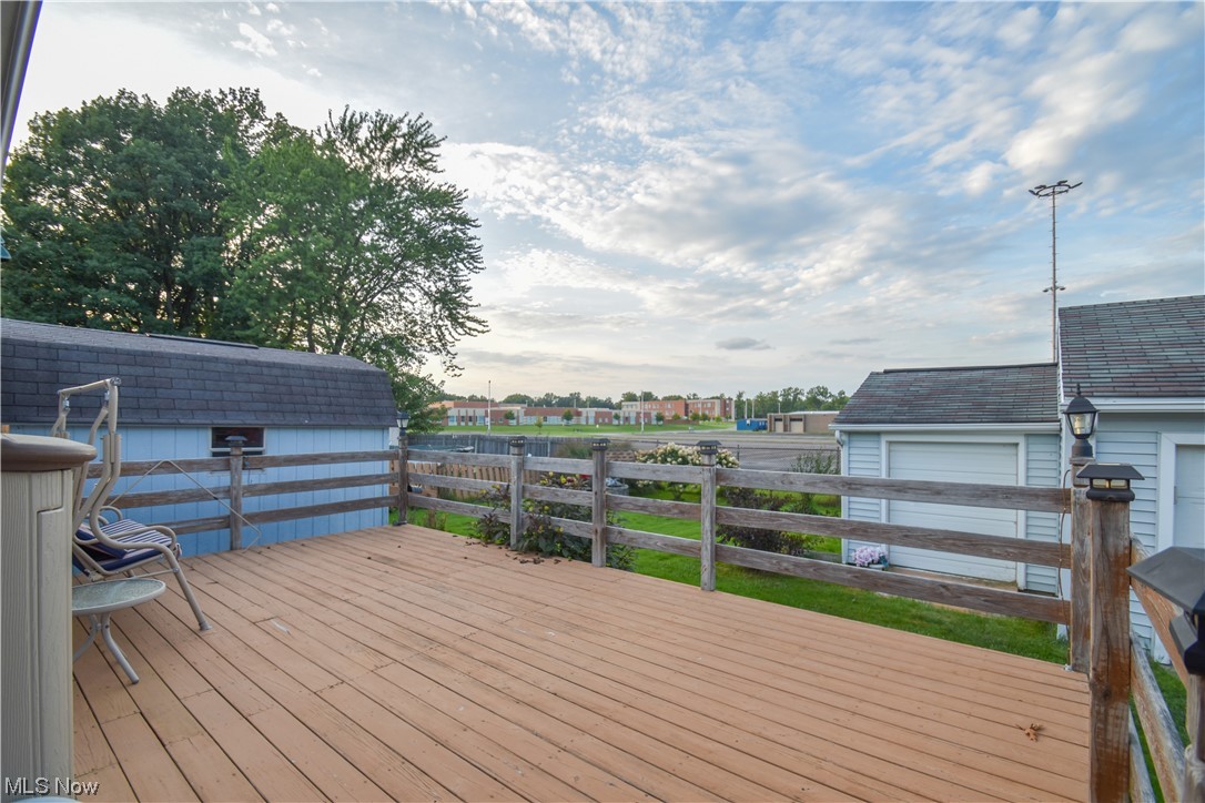 4606 Burkey Road Youngstown, OH 44515 - Photo 36 of 49 Wooden deck featuring a garage and an outdoor structure