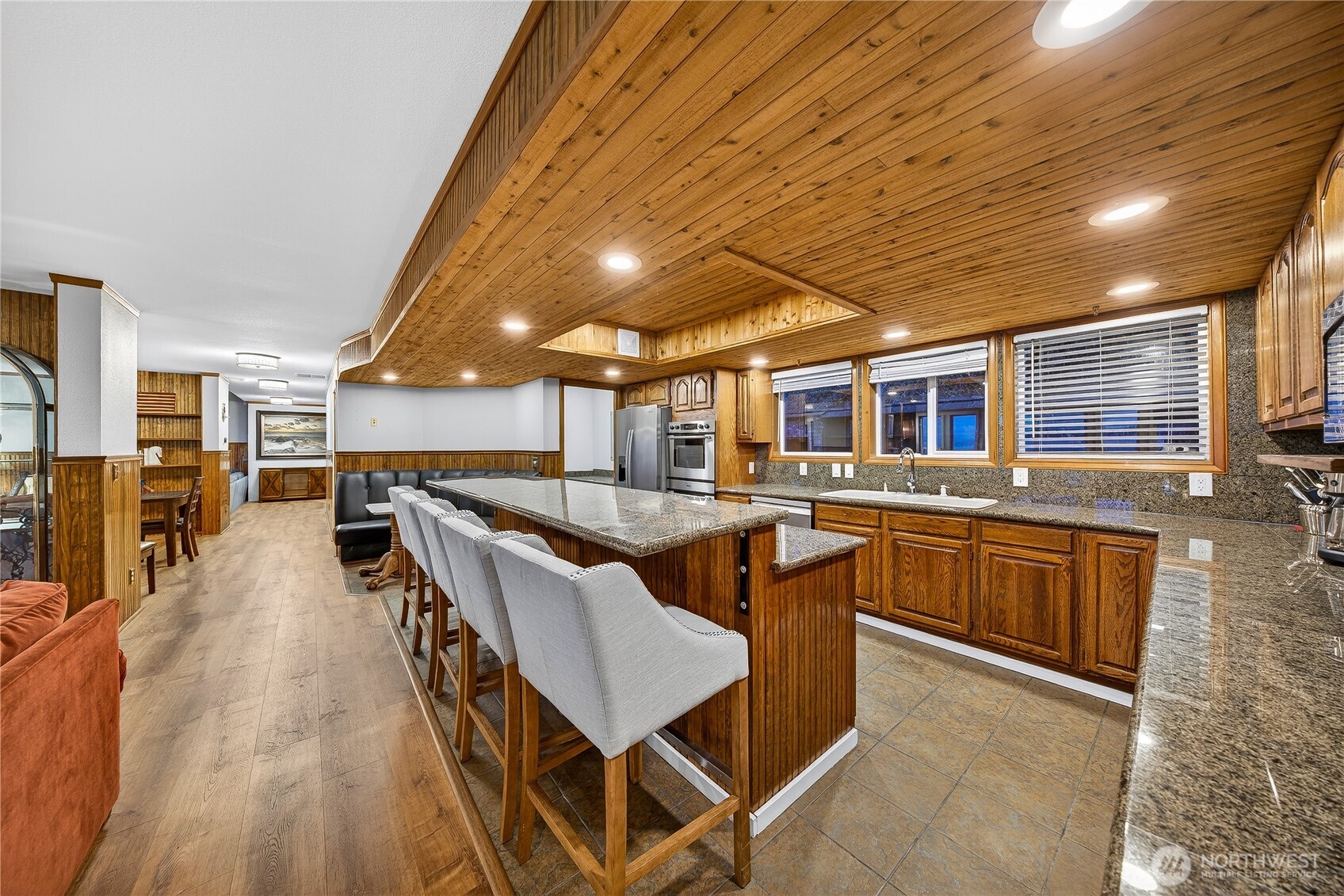 5972 Hastings Road Clinton, WA 98236 - Photo 29 of 40 a dining hall with stainless steel appliances granite countertop a stove and cabinets