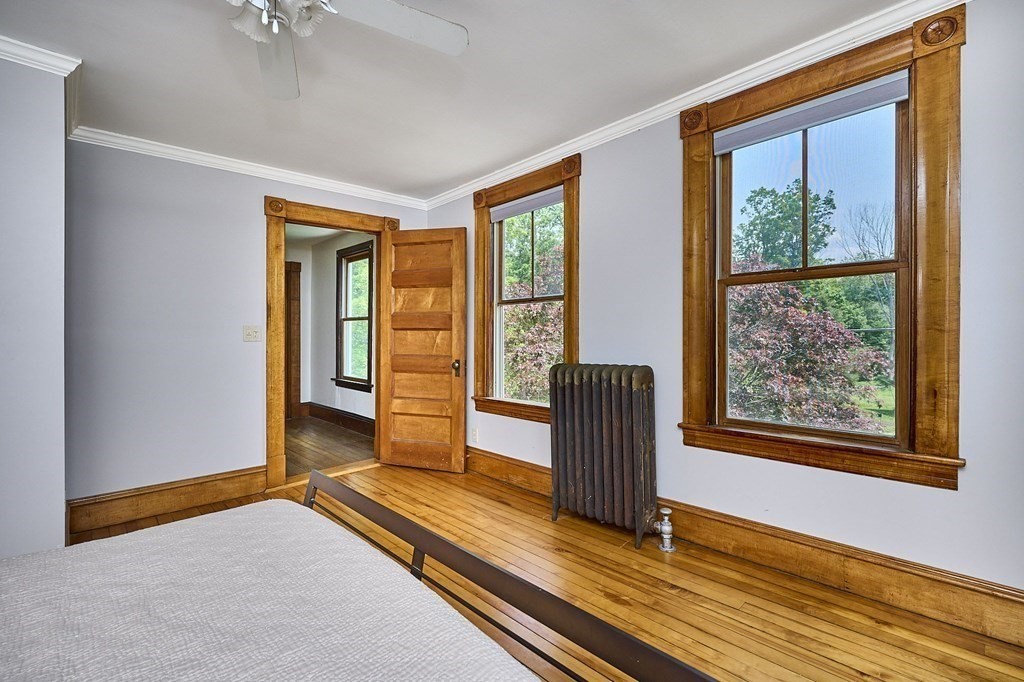 39 Laurel Mountain Road Haydenville, MA 01039 - Photo 21 of 42 a view of an empty room with window wooden floor and front door