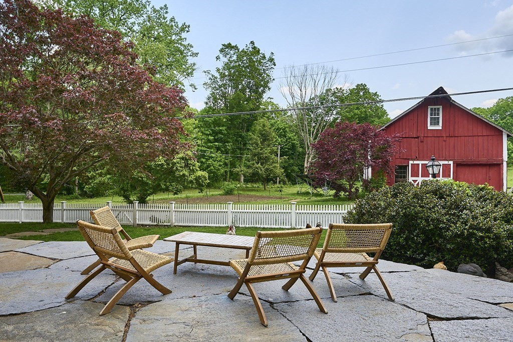 39 Laurel Mountain Road Haydenville, MA 01039 - Photo 28 of 42 a view of a chairs and table in the backyard