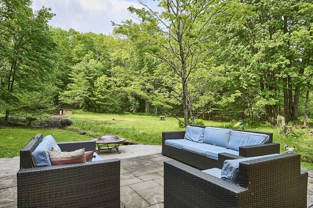 39 Laurel Mountain Road Haydenville, MA 01039 - Photo 32 of 42 a view of yard with outdoor seating and green space