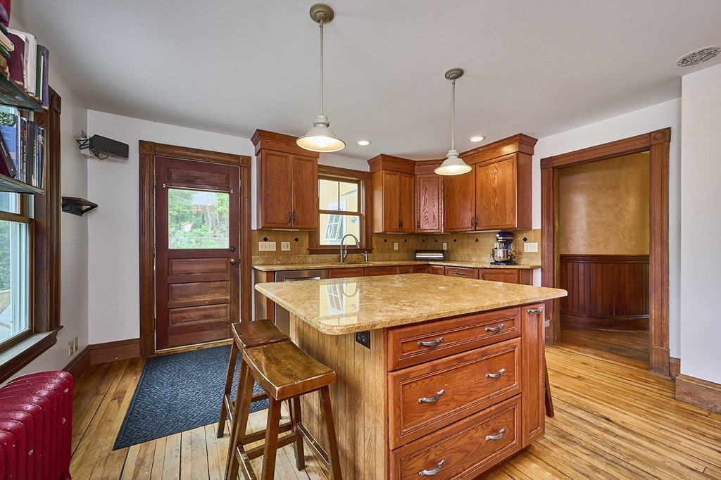 39 Laurel Mountain Road Haydenville, MA 01039 - Photo 4 of 42 a kitchen with a refrigerator a sink and wooden floor