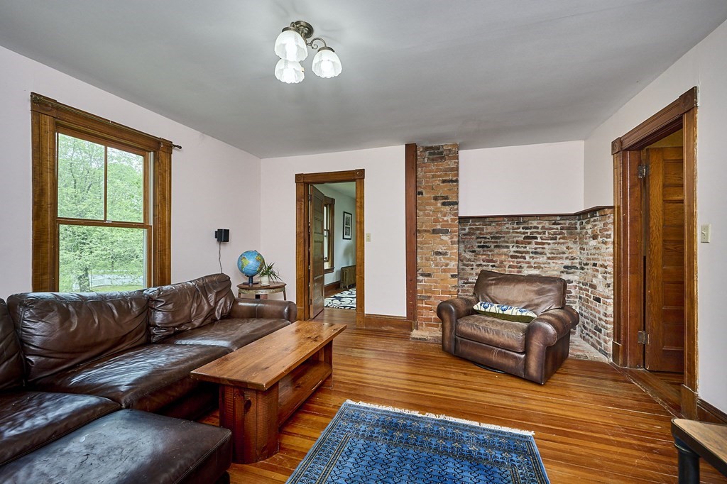 39 Laurel Mountain Road Haydenville, MA 01039 - Photo 8 of 42 a living room with furniture and a fireplace