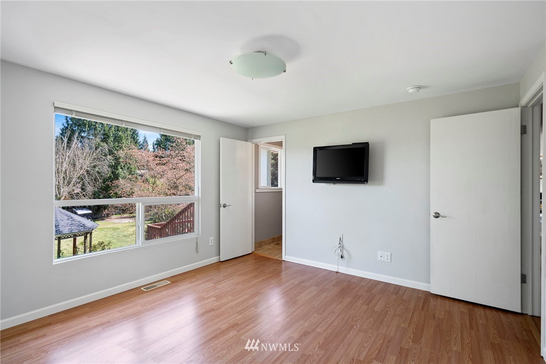 10831 38th Drive Southeast Everett, WA 98208 - Photo 18 of 40 a view of a livingroom with wooden floor and windows