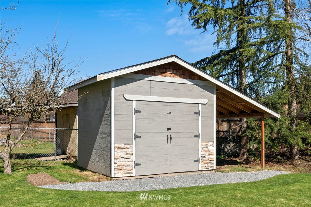 10831 38th Drive Southeast Everett, WA 98208 - Photo 31 of 40 a front view of a house with a yard