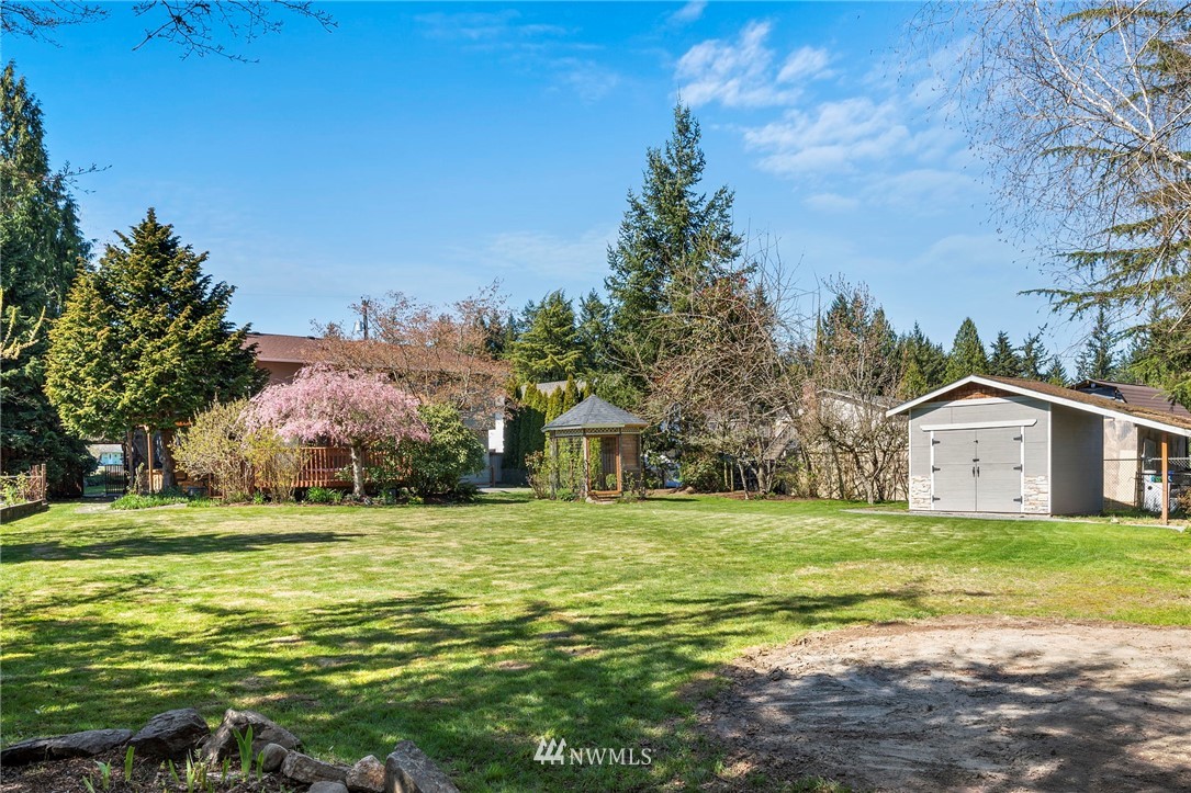 10831 38th Drive Southeast Everett, WA 98208 - Photo 33 of 40 a view of a big yard with a house in the background