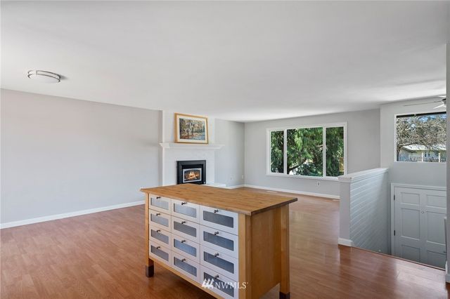 a view of kitchen with furniture and wooden floor