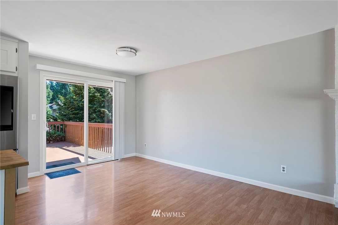 10831 38th Drive Southeast Everett, WA 98208 - Photo 10 of 40 a view of an empty room with wooden floor and a window