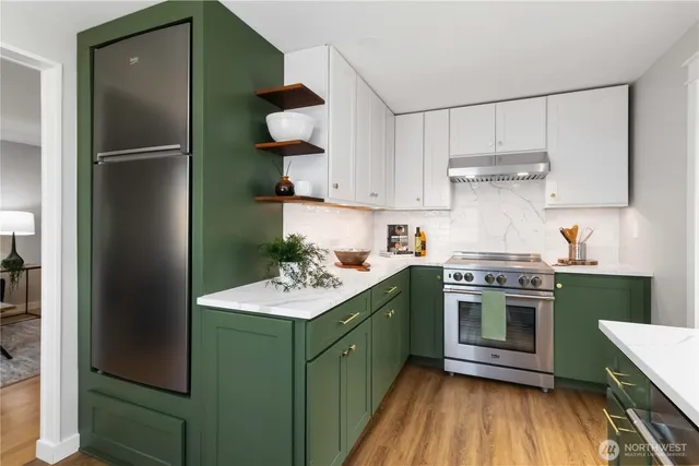a kitchen with a sink stainless steel appliances and cabinets