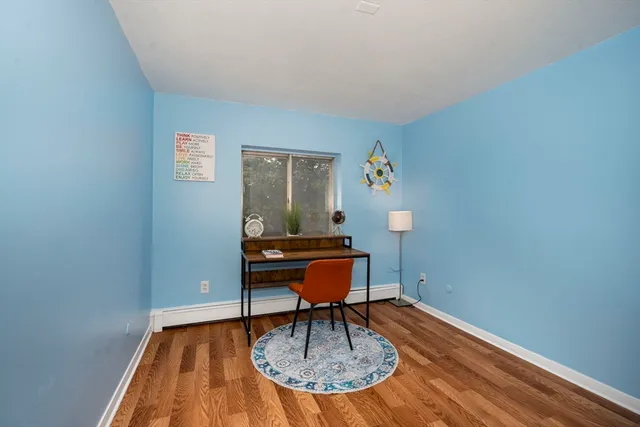 a workspace with furniture and wooden floor