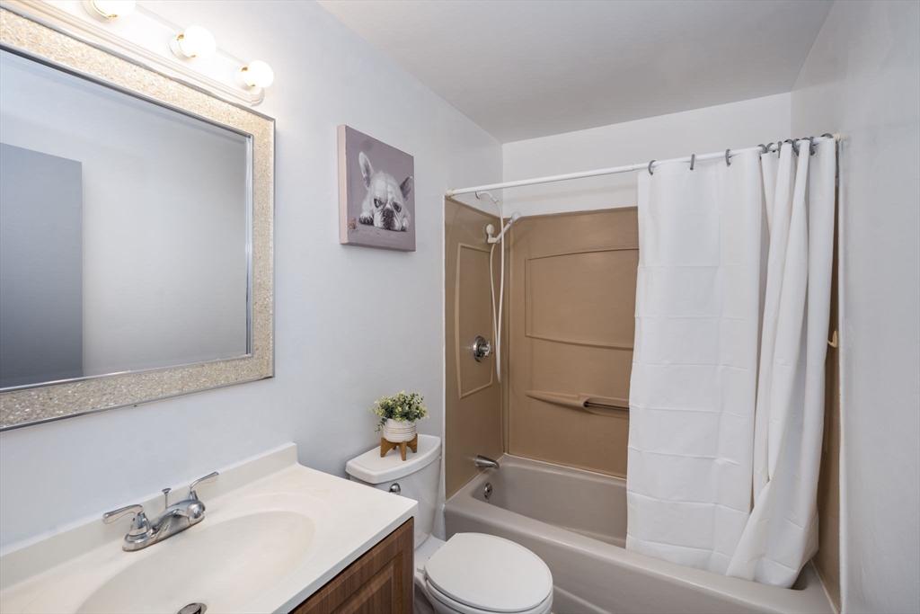 426 Pleasant Street, Unit 17 Malden, MA 02148 - Photo 26 of 36 a bathroom with a sink toilet and shower
