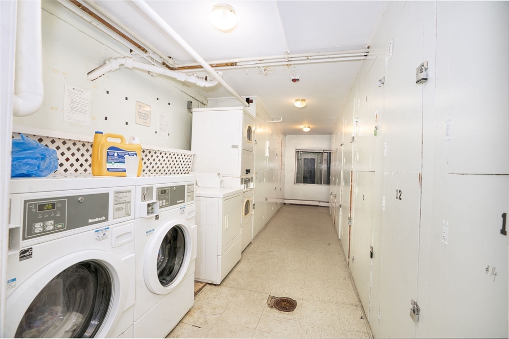 426 Pleasant Street, Unit 17 Malden, MA 02148 - Photo 30 of 36 a view of a storage & utility room with washer and dryer