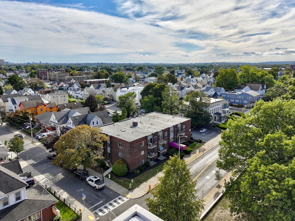 426 Pleasant Street, Unit 17 Malden, MA 02148 - Photo 33 of 36 an aerial view of a houses with yard