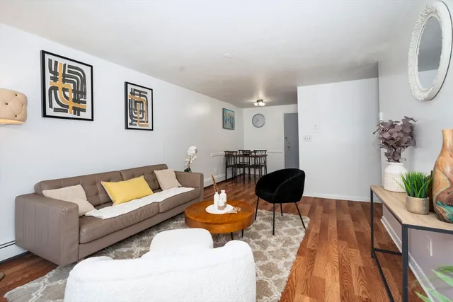a living room with furniture and a lamp