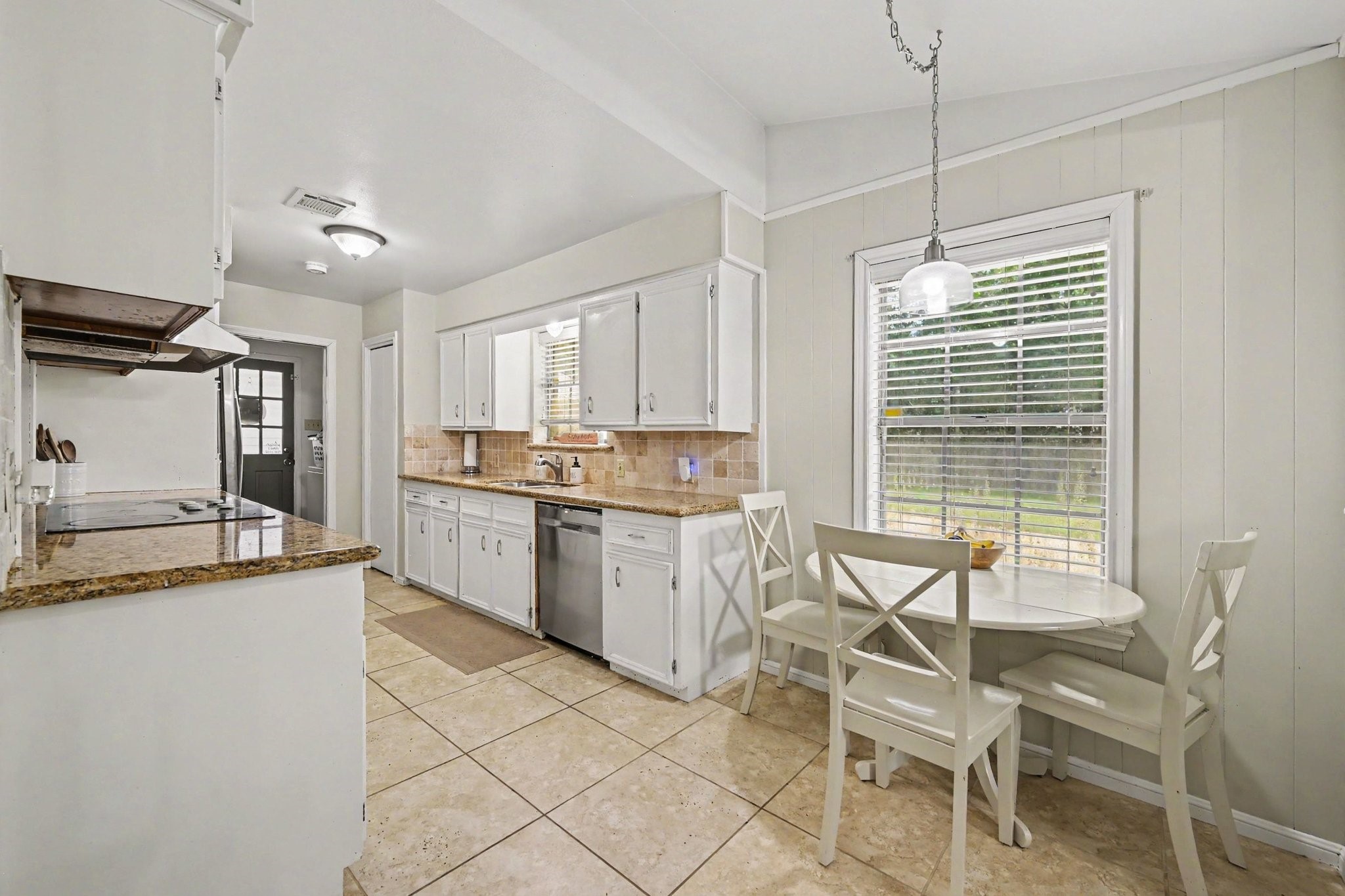 3203 Eula Morgan Road Katy, TX 77493 - Photo 9 of 32 The galley type kitchen has plenty of work space and leads to the utility room and the door to the backyard.