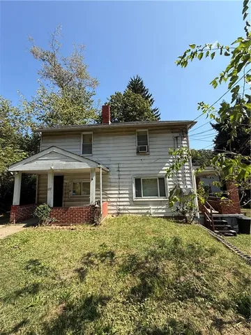 a front view of house with yard