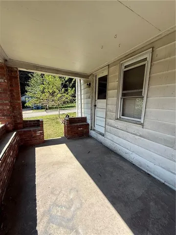 a living room with large windows