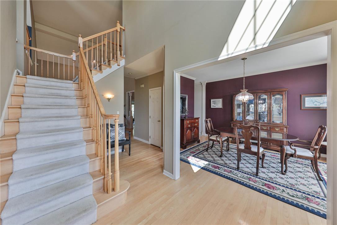 63 Long Road Lenhartsville, PA 19534 - Photo 26 of 100 An inviting entryway leads past a carpeted staircase toward the adjoining formal dining room.