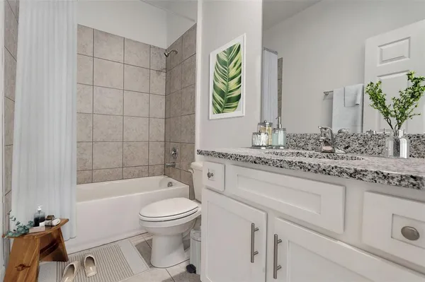 a white toilet sitting next to a bathroom sink