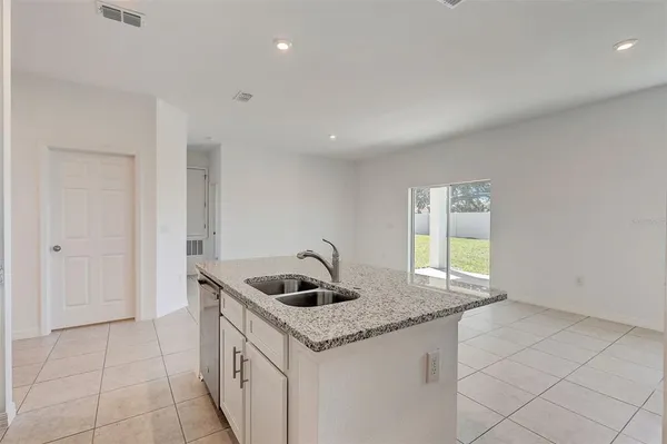 a kitchen that has a sink and a stove