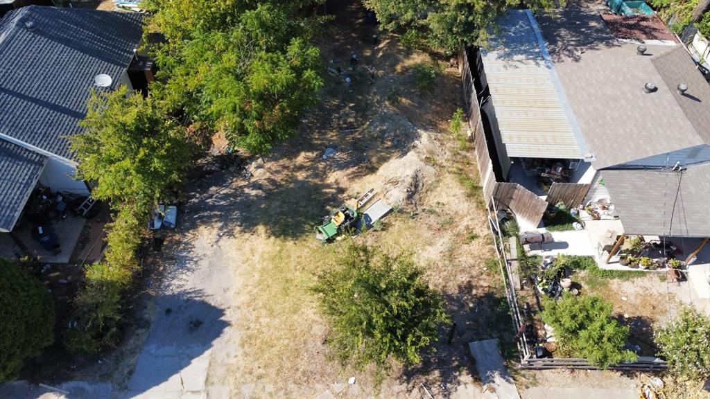1333 Amos Street Dallas, TX 75212 - Photo 2 of 12 a backyard of a house with a yard and outdoor seating
