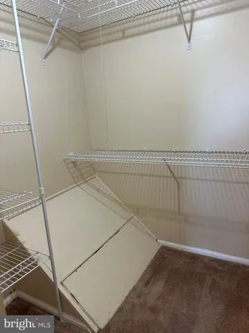 a view of a room with racks on the wall