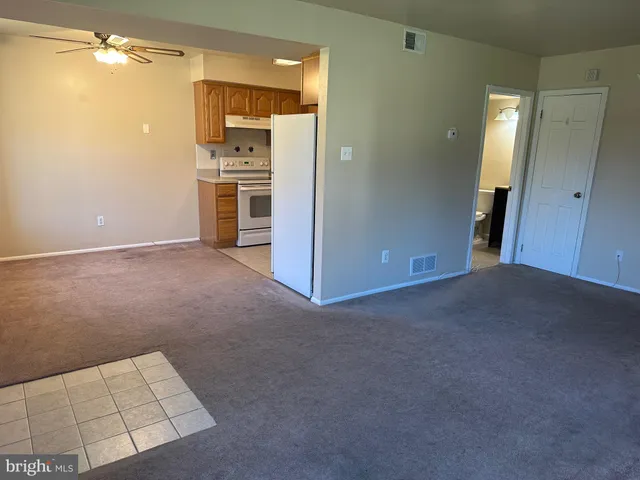 a view of a kitchen with a sink