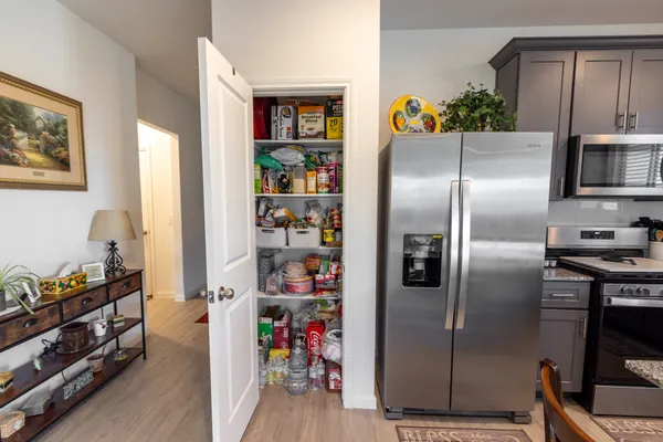a living room with furniture window and a flat screen tv