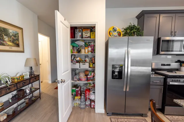 a spacious bedroom with a bed and a window