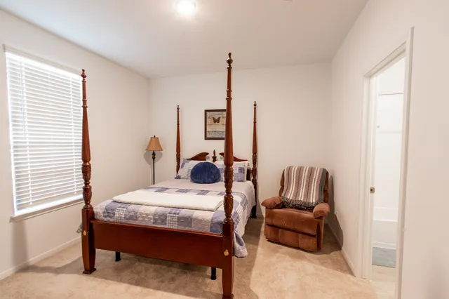 a view of a house with backyard and porch