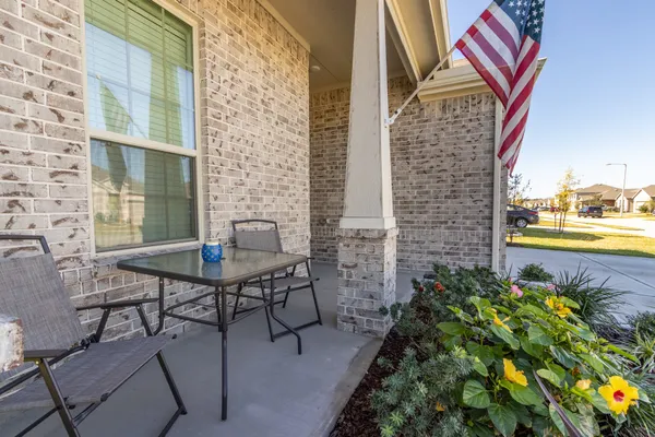 a backyard of a house with outdoor seating