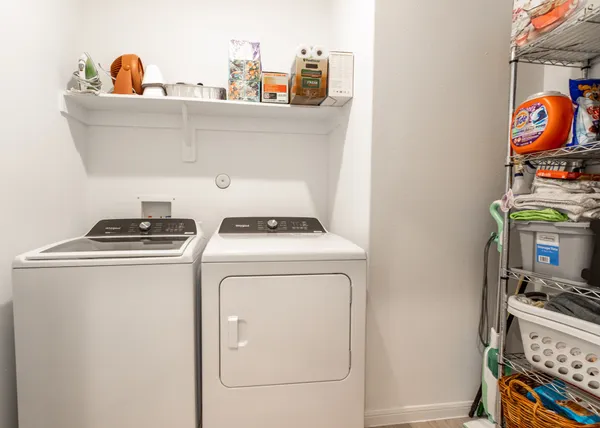 a view of a house with backyard and porch