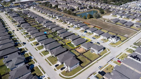 a room with wooden floor and furniture