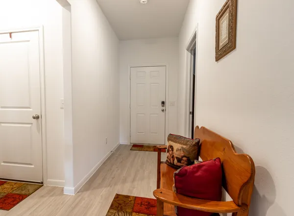 a large kitchen with kitchen island a large counter top space a sink stainless steel appliances and cabinets