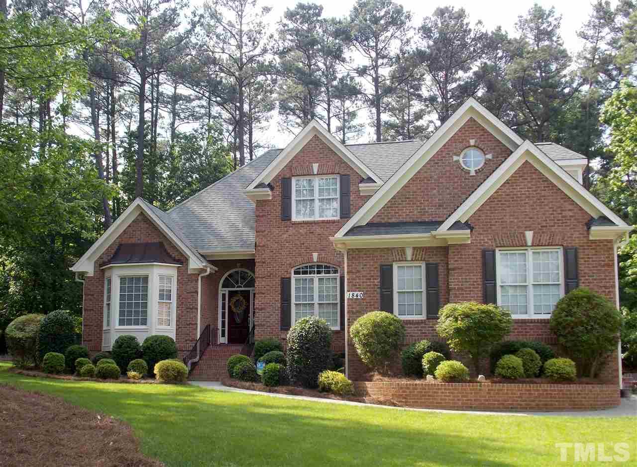 1840 Bowling Green Trail Raleigh, NC 27613 - Photo 1 of 16 a front view of a house with garden