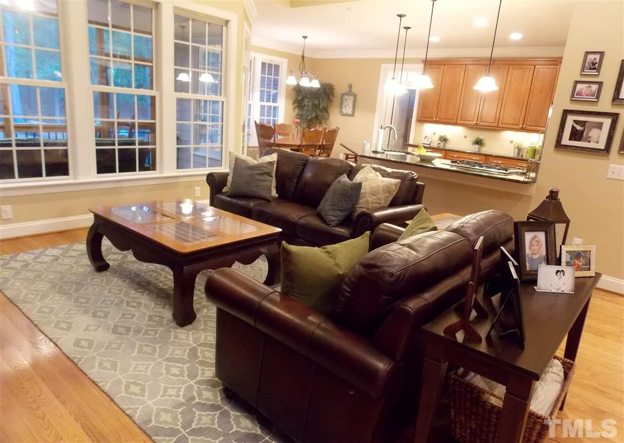 1840 Bowling Green Trail Raleigh, NC 27613 - Photo 2 of 16 a living room with furniture and a floor to ceiling window