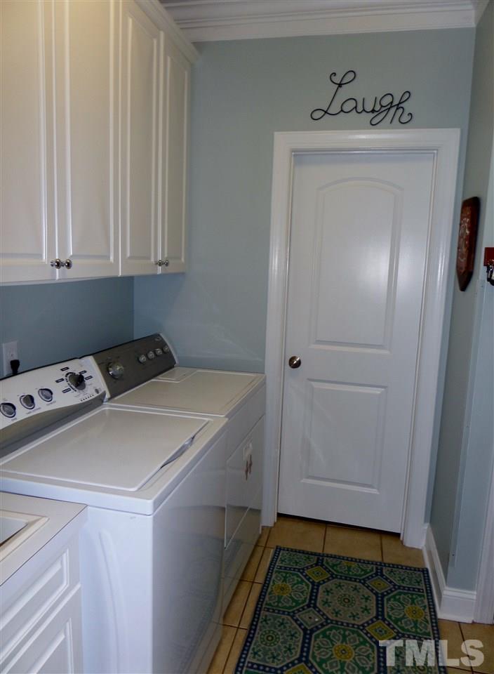 1840 Bowling Green Trail Raleigh, NC 27613 - Photo 12 of 16 a room with a sink and cabinets