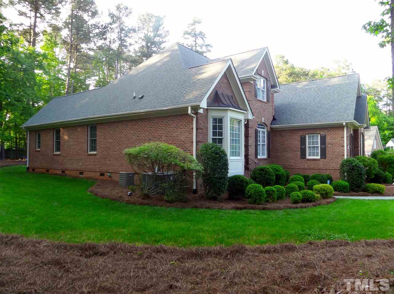 1840 Bowling Green Trail Raleigh, NC 27613 - Photo 13 of 16 a front view of a house with garden