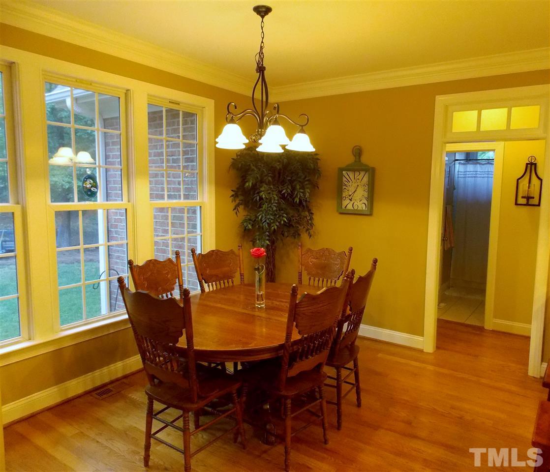 1840 Bowling Green Trail Raleigh, NC 27613 - Photo 3 of 16 a dining room with furniture and window