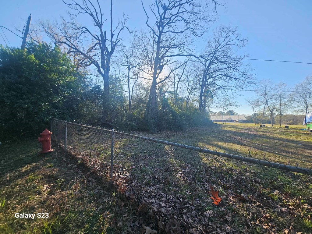 210 Madison Street Lufkin, TX 75901 - Photo 6 of 9 a backyard of a house with lots of green space
