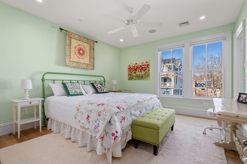 16 Everett Street, Unit 202 Boston, MA 02130 - Photo 11 of 19 a bedroom with a bed and a couch