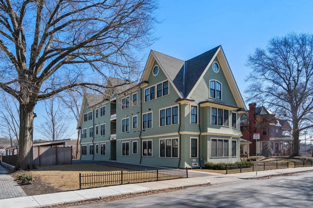 16 Everett Street, Unit 202 Boston, MA 02130 - Photo 15 of 19 a front view of a building with lot of trees