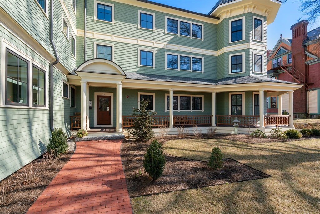 16 Everett Street, Unit 202 Boston, MA 02130 - Photo 18 of 19 a front view of a house with a yard outdoor seating and floor to ceiling windows