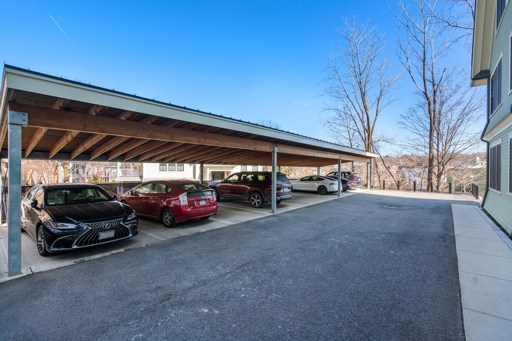 16 Everett Street, Unit 202 Boston, MA 02130 - Photo 19 of 19 a view of parking garage with cars parked