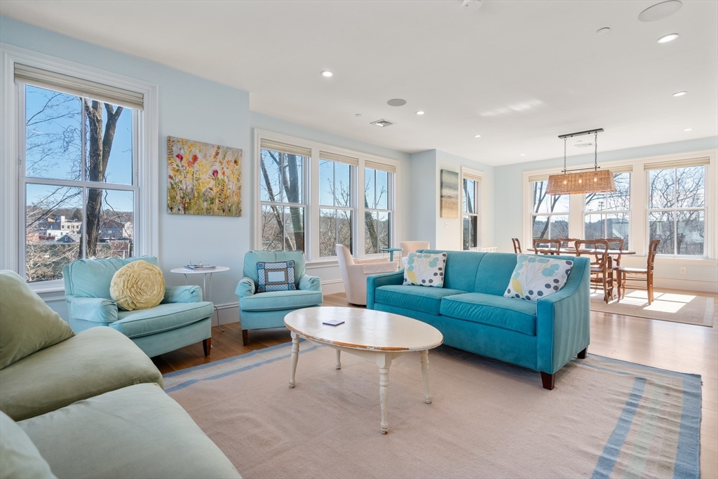 16 Everett Street, Unit 202 Boston, MA 02130 - Photo 2 of 19 a living room with furniture and a large window
