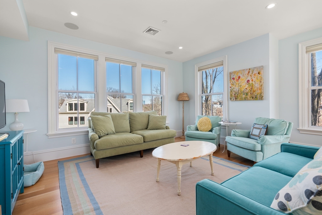 16 Everett Street, Unit 202 Boston, MA 02130 - Photo 3 of 19 a living room with furniture and a large window