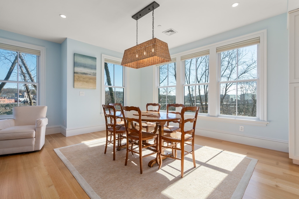 16 Everett Street, Unit 202 Boston, MA 02130 - Photo 4 of 19 a view of a dining room with furniture window and wooden floor